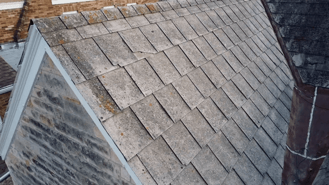 close up of a house with asbestos on their roof in Minneapolis 