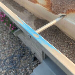 Close up of hail damaged gutter on Minneapolis home