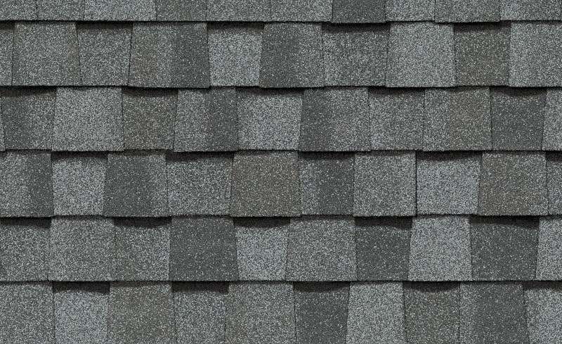 Cropped image of gray asphalt roof shingles, this is the most common type of roof in Minneapolis