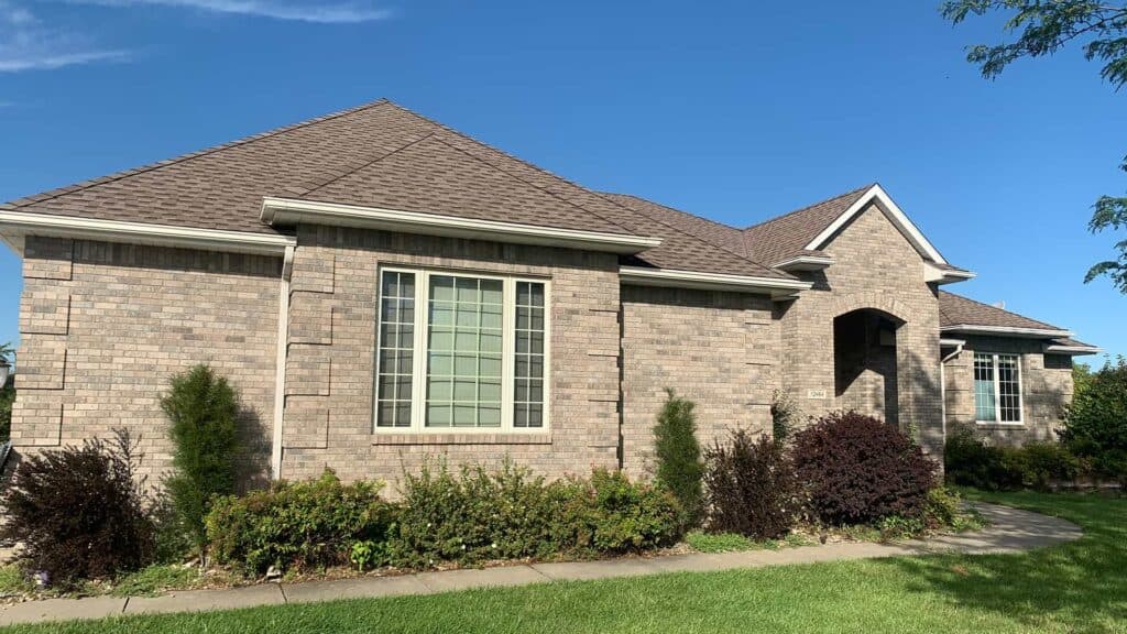 Exterior of Minneapolis house after roof replacement from insurance