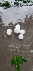 Large hail on sidewalk after storm in Minneapolis