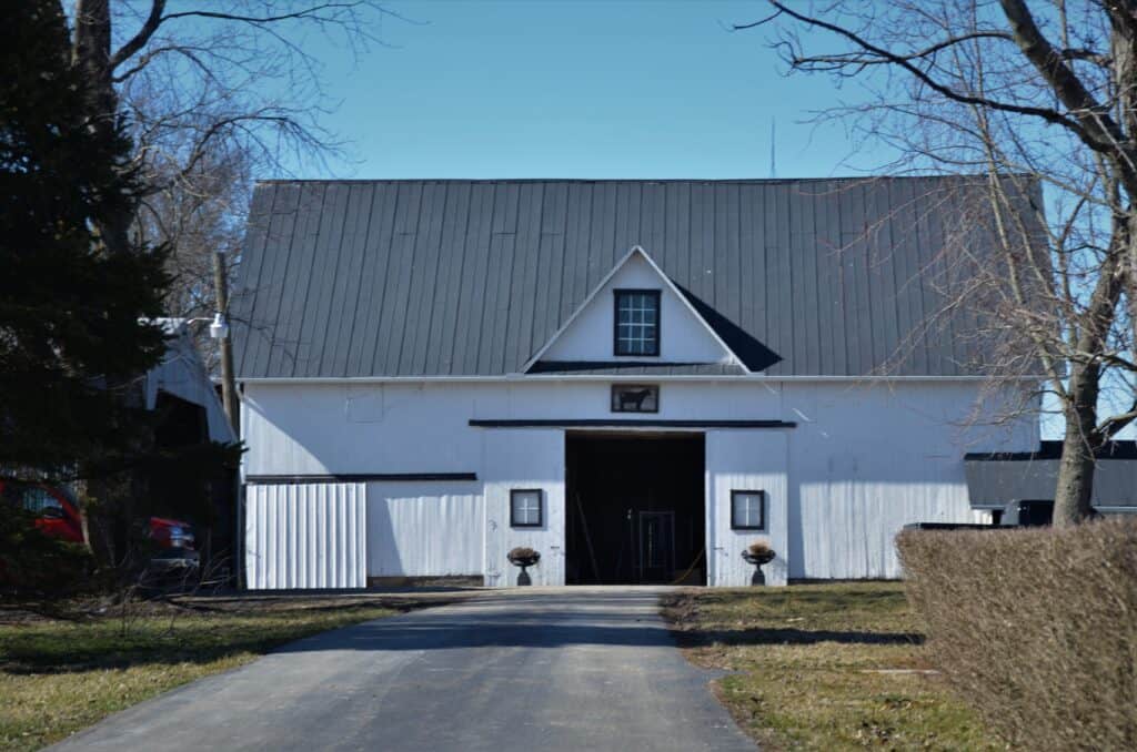 White barn with metal standing seam roof in Lake Elmo, MN