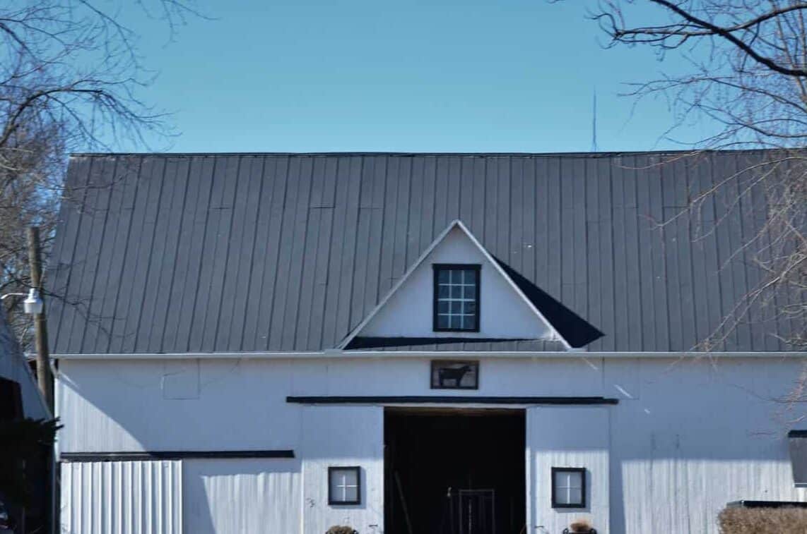 White barn with metal standing seam roof in Lake Elmo, MN