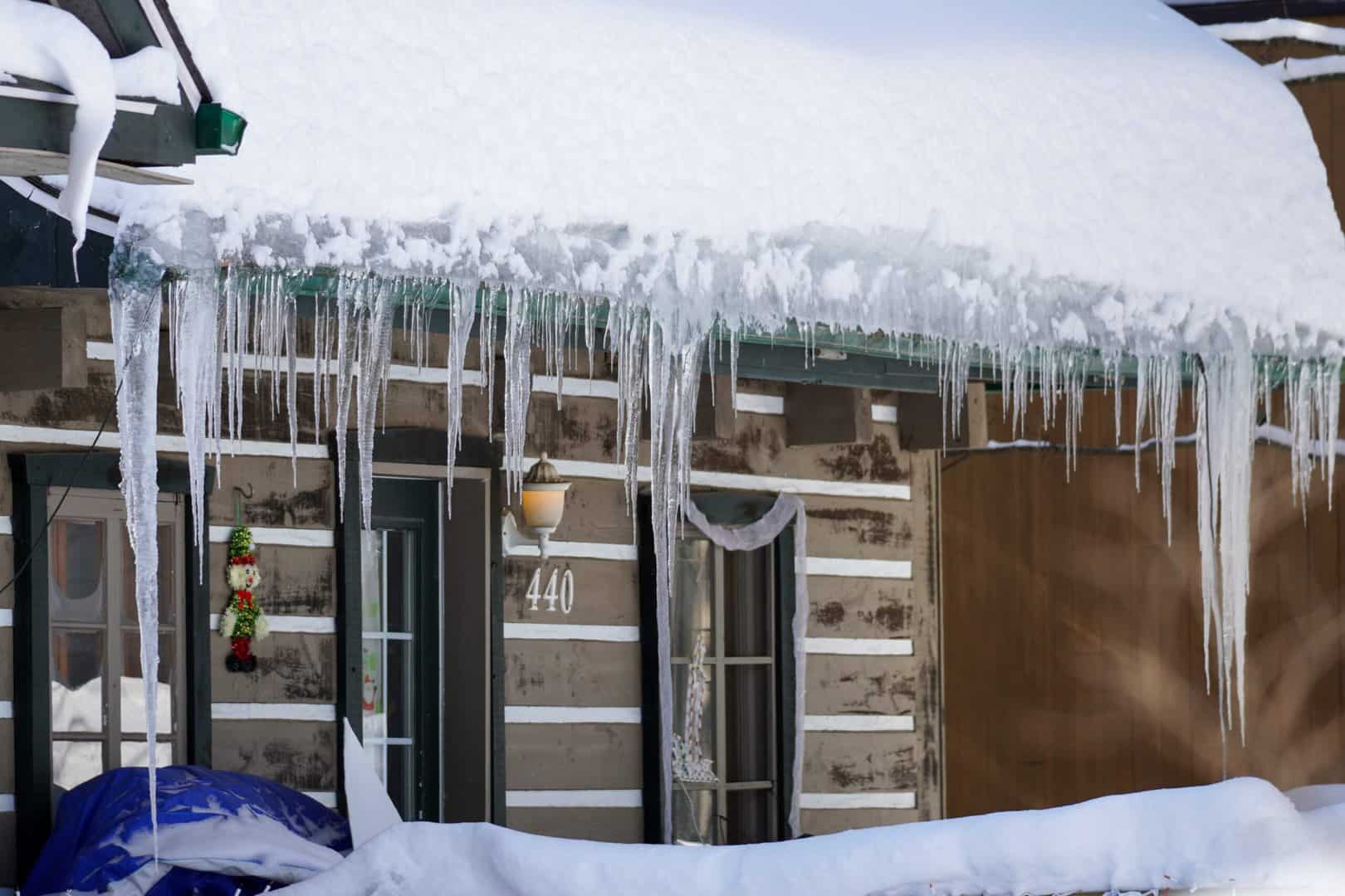 Minneapolis roof covered in snow and icicles.